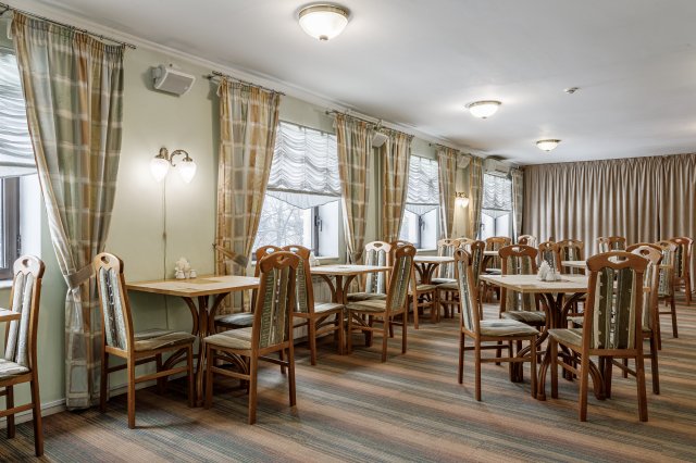 The cozy Slavia cafe welcomes guests on the 2nd floor